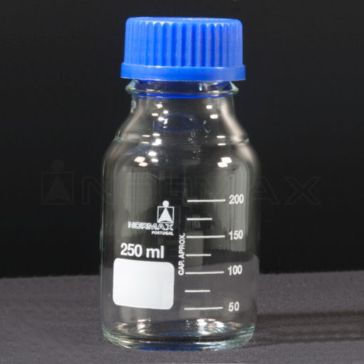 Frasco, vidrio claro, tapa rosca azul, graduado. Normax